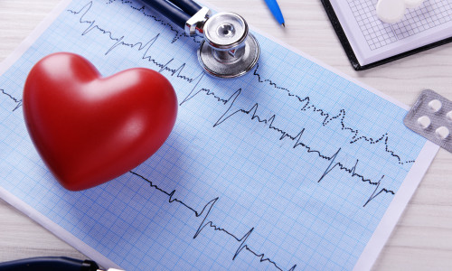 Cardiogram,With,Stethoscope,And,Red,Heart,On,Table,,Closeup