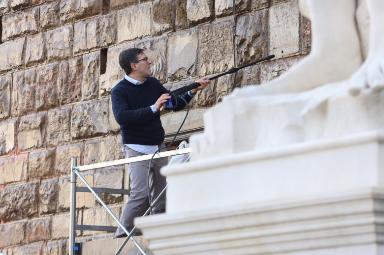 Italy, Florence: Members of Ultima Generazione, Last Generation climate civil-disobedience group, spray paint over Palazzo Vecchio next to the David masterpiece of Renaissance sculpture created by the Italian artist Michelangelo Buonarroti