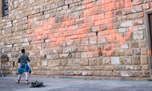 Italy, Florence: Members of Ultima Generazione, Last Generation climate civil-disobedience group, spray paint over Palazzo Vecchio next to the David masterpiece of Renaissance sculpture created by the Italian artist Michelangelo Buonarroti