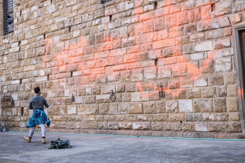 Italy, Florence: Members of Ultima Generazione, Last Generation climate civil-disobedience group, spray paint over Palazzo Vecchio next to the David masterpiece of Renaissance sculpture created by the Italian artist Michelangelo Buonarroti