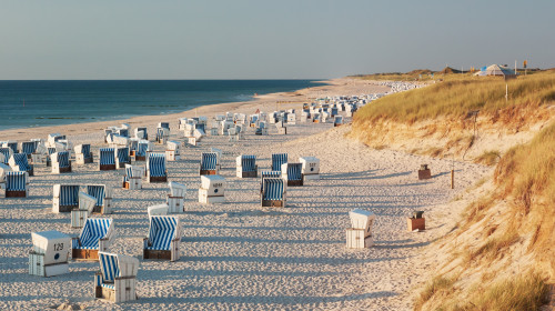 Beach,With,Strandkorbs,(beach,Basket,Chairs),And,Dunes,In,Evening