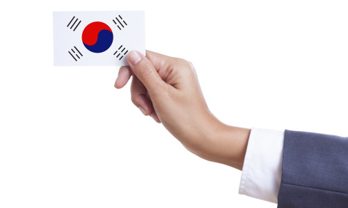 Businessman,Holding,A,Business,Card,With,South,Korea,Flag