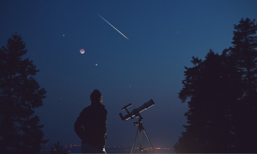 Silhouette,Of,A,Man,,Telescope,,Stars,,Planets,And,Shooting,Star