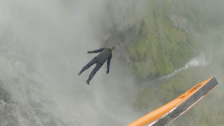 Tom Crusie reveals how he pulled off a stunning Mission Impossible cliff jump stunt in a new behind-the-scenes mini movie