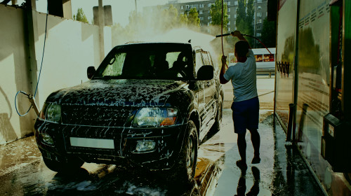 A,Man,Washes,His,Car,During,The,Day,,Washes,Of