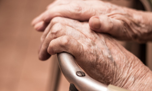 Elderly,Hands,On,A,Walker