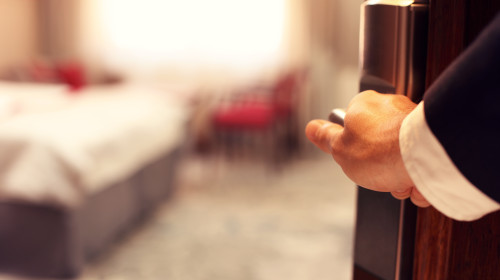 Picture,Showing,Hand,Of,Businessman,Opening,Hotel,Room