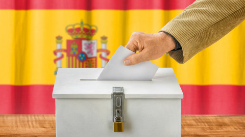 Man,Putting,A,Ballot,Into,A,Voting,Box,-,Spain
