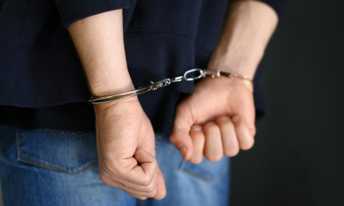 Man,Detained,In,Handcuffs,Indoors,,Closeup,View.,Criminal,Law