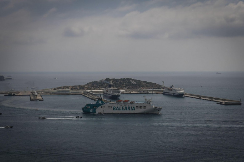 A ferry from the Balearia company sails from the port of the city of Ibiza towards the island of Formentera.