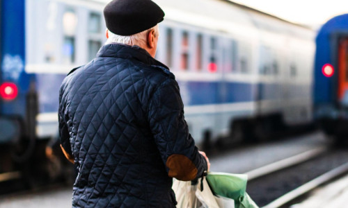 Travelers and commuters waiting for a train on the platform of Bucharest North Railway Station (Gara de Nord) in Bucharest, Romania, 2020