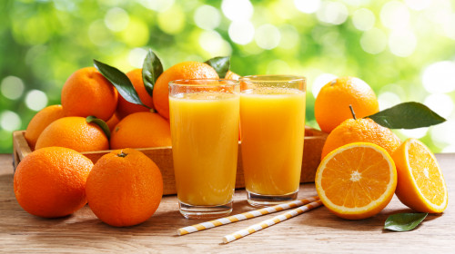 Glasses,Of,Fresh,Orange,Juice,With,Fresh,Fruits,Over,A