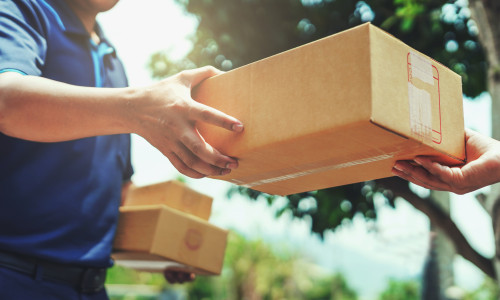 Delivery,Man,Delivering,Holding,Parcel,Box,To,Customer