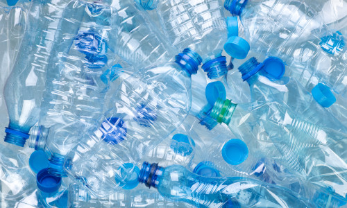 Plenty,Of,Plastic,Bottles,On,White,Background,Top,View