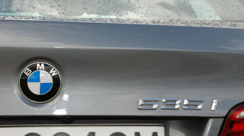 BMW 535i - MY 2010 - gray metallic - German premium higher class sedan, segment E (executive) - details: BMW badge, 535i logo