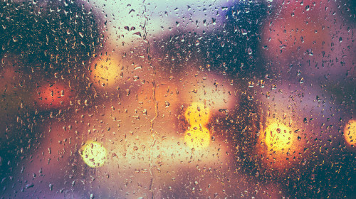 Drops,Of,Rain,On,Blue,Glass,Background.,Street,Bokeh,Lights