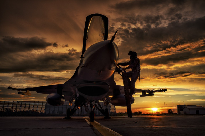 Romanian Air Force F-16AM Fighting Falcon, improved to mid-life upgrade (MLU) 5.2R standard, seen on the sunset at 86thÂ Air Base, Borcea, Romania, home of the 53rd Fighter Squadron.,Image: 777202747, License: Rights-managed, Restrictions: Rights to be cleared for artworks not in public domain. No model release., Model Release: no