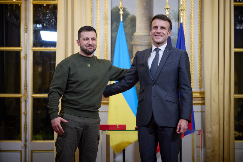 Handout photo shows France's President Emmanuel Macron presents his Ukrainian counterpart Volodymyr Zelensky with the Legion of Honor, the highest French decoration, at the Elysee presidential palace ahead of a working diner with German Chancellor in Paris, France on February 8, 2023. Zelensky made today his first visits to Britain and France since the Russian invasion almost one year ago, pressing his allies for more weaponry and in particular fighter jets.,Image: 754988734, License: Rights-managed, Restrictions: *** HANDOUT image or SOCIAL MEDIA IMAGE or FILMSTILL for EDITORIAL USE ONLY! * Please note: Fees charged by Profimedia are for the Profimedia's services only, and do not, nor are they intended to, convey to the user any ownership of Copyright or License in the material. Profimedia does not claim any ownership including but not limited to Copyright or License in the attached material. By publishing this material you (the user) expressly agree to indemnify and to hold Profimedia and its directors, shareholders and employees harmless from any loss, claims, damages, demands, expenses (including legal fees), or any causes of action or allegation against Profimedia arising out of or connected in any way with publication of the material. Profimedia does not claim any copyright or license in the attached materials. Any downloading fees charged by Profimedia are for Profimedia's services only.