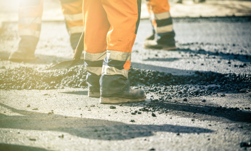 Teamwork,,Group,Of,Workers,On,A,Road,Construction,,Team,Of