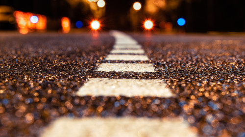 Asphalt,Road,Leading,Into,The,City,At,Night.,Selective,Focus.