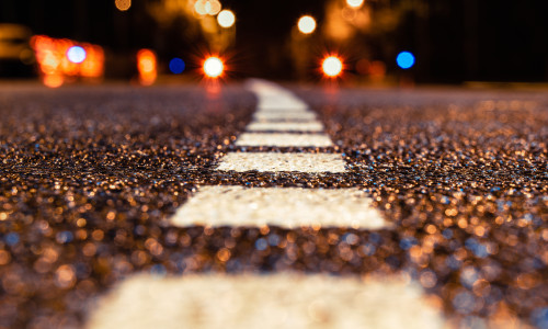 Asphalt,Road,Leading,Into,The,City,At,Night.,Selective,Focus.