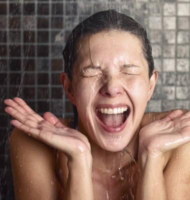 Young,Woman,Reacting,In,Shock,To,Hot,Or,Cold,Shower