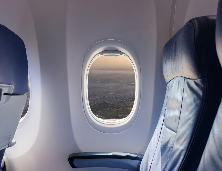Empty,Seat,Airplane,And,Window,View,Inside,An,Aircraft