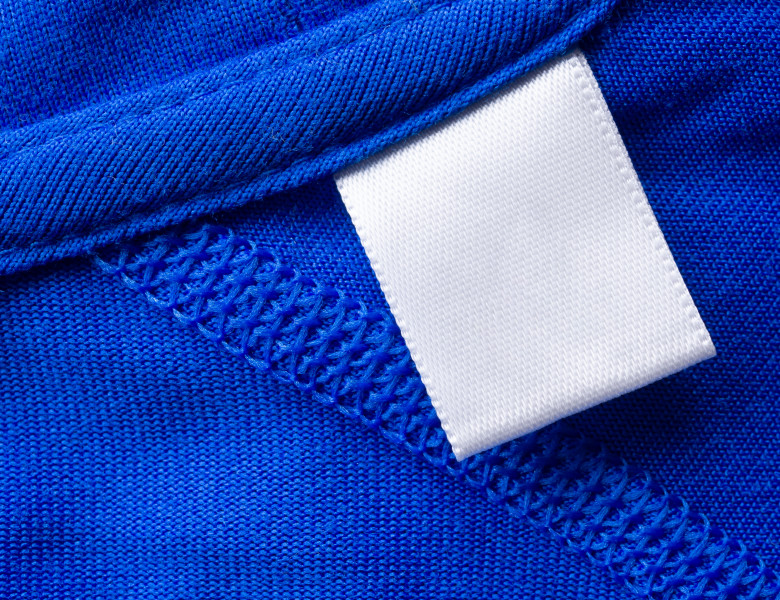 Blank,White,Laundry,Care,Clothes,Label,On,Blue,Fabric,Texture