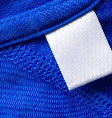 Blank,White,Laundry,Care,Clothes,Label,On,Blue,Fabric,Texture