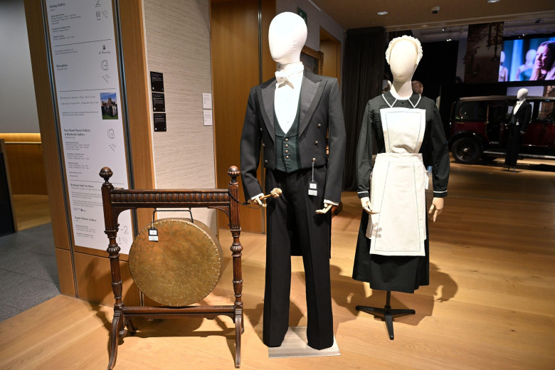 Victorian brass dinner gong, under-butler uniform worn by Rob James-Collier (Thomas Barrow) and a Lady's Maid uniform from Downton Abbey - Bonhams