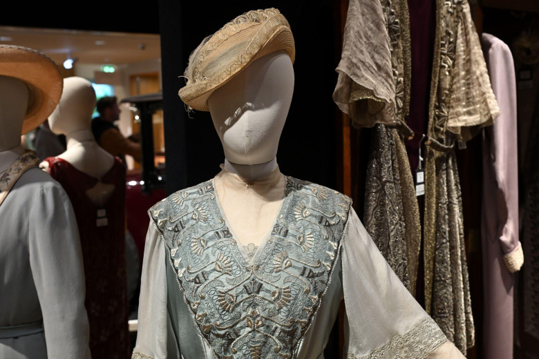 Dame Maggie Smith (as Violet Crawley, Dowager Countess of Grantham): Pale sea green dress with silver detailing -
