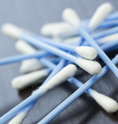 Cotton swabs in blue with white cotton wool as a close-up