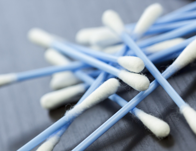 Cotton swabs in blue with white cotton wool as a close-up