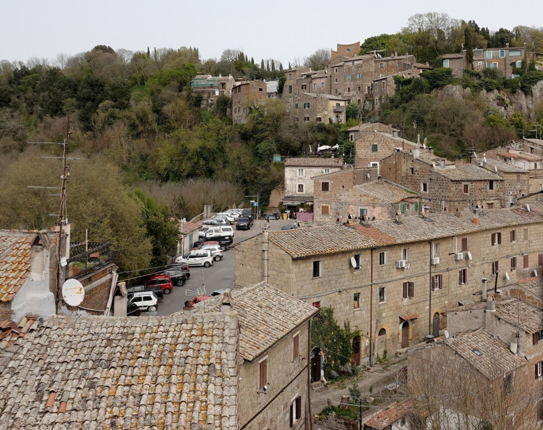 *EXCLUSIVE* WEB MUST CALL FOR PRICING  - Monica Bellucci and Tim Burton pack on the PDA as they enjoy a little fine Italian dining during their romantic trip to Calcata.*PICTURES TAKEN ON 30/03/2024*