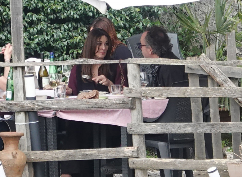 *EXCLUSIVE* WEB MUST CALL FOR PRICING  - Monica Bellucci and Tim Burton pack on the PDA as they enjoy a little fine Italian dining during their romantic trip to Calcata.*PICTURES TAKEN ON 30/03/2024*