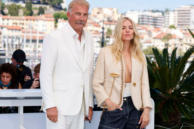 Kevin Costner and Sienna Miller pose at the photo call of 'Horizon: An American Saga' during the 77th Cannes Film Festival at Palais des Festivals in Cannes, France, on 19 May 2024.