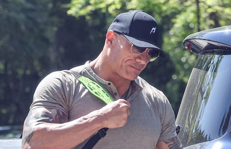 *EXCLUSIVE* Don't mess with The Rock! Dwayne Johnson shows off his bulked muscles after reports of continuing feud with Ryan Reynolds on new film set*** Web must call for pricing ***