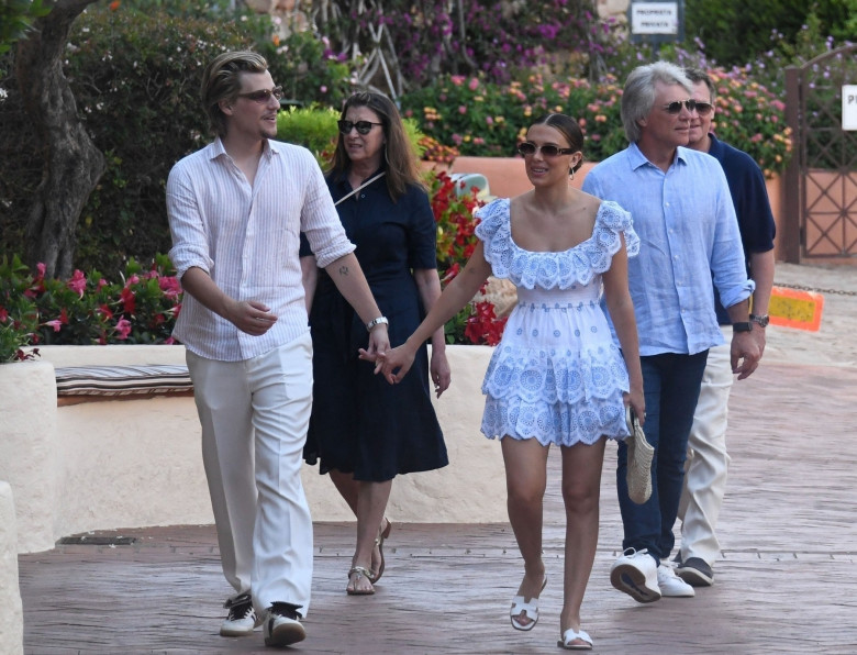 *PREMIUM-EXCLUSIVE* *MUST CALL FOR PRICING* Recently married 'Stranger Things' star Millie Bobby Brown and her new husband, the American model and actor Jake Bongiovi spotted taking a family stroll around the famous Porto Cervo square during their family