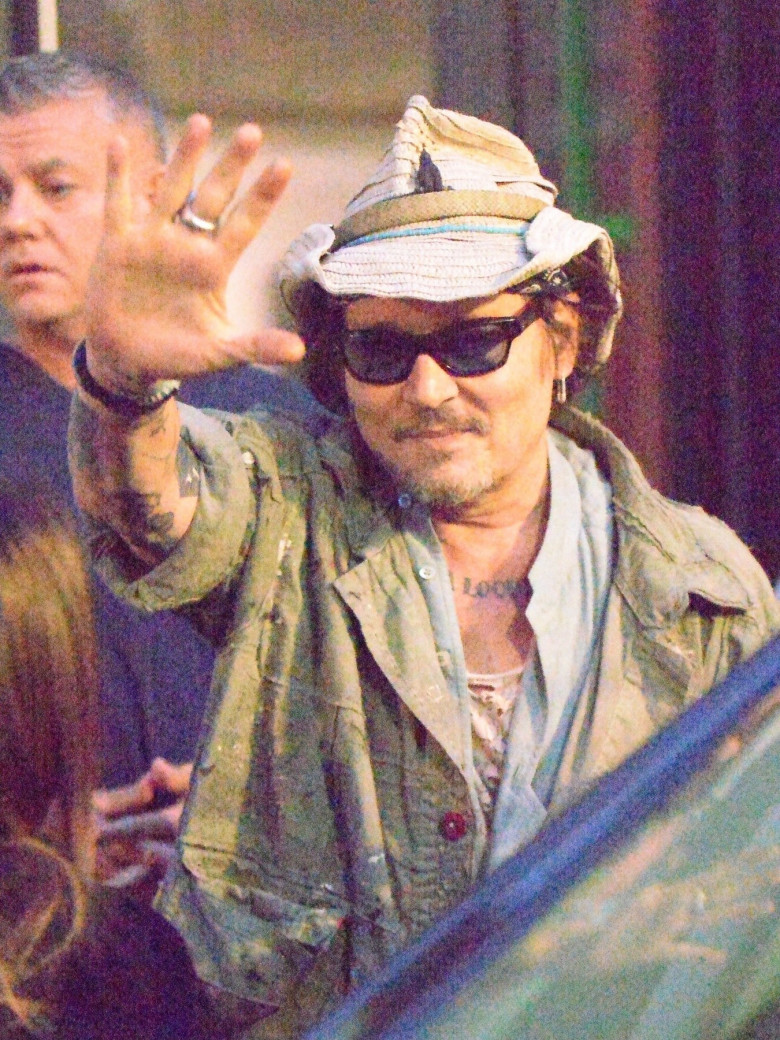 *EXCLUSIVE* Howdy! Johnny Depp toffs his hat as a sign of respect to his loyal fans who were waiting for him as he left his hotel out in London.