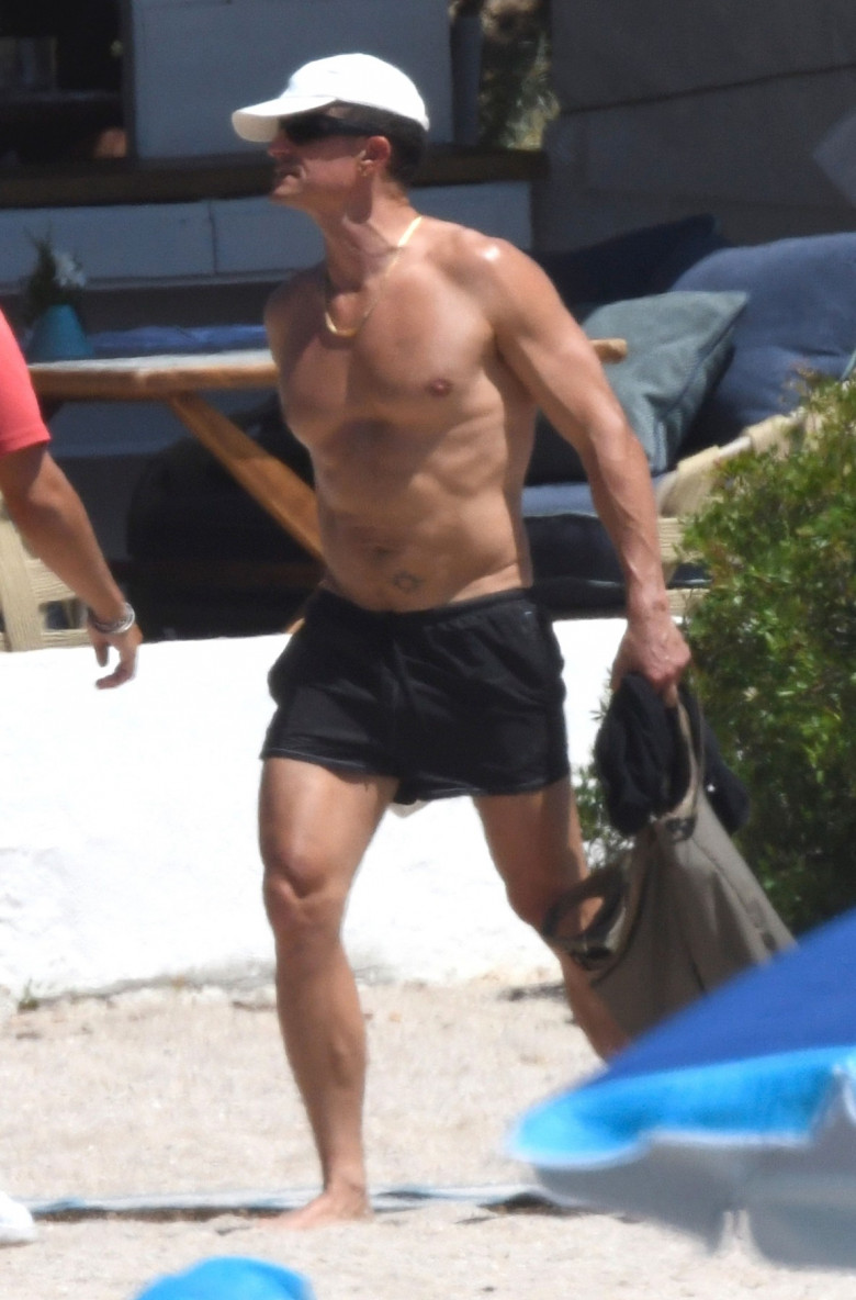 *EXCLUSIVE* WEB MUST CALL FOR PRICING  - Showing off his impressive physique out in the Italian sunshine, The British Actor Orlando Bloom with his daughter Daisy enjoy a day at the beach out in Porto Cervo.*PICTURES TAKEN ON 04/07/2024*