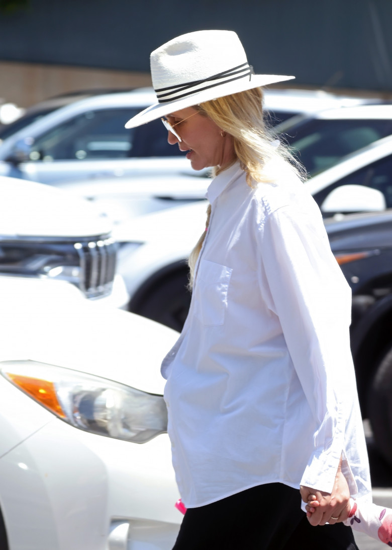 *EXCLUSIVE* Cameron Diaz keeps a low-profile in a white fedora as she shops with her daughter in Santa Barbara