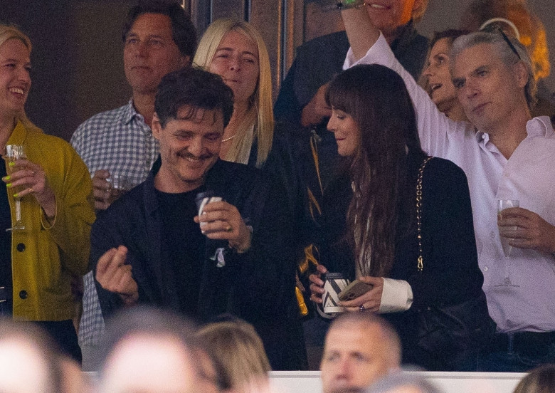 *PREMIUM-EXCLUSIVE* MUST CALL FOR PRICING BEFORE USAGE  - Dakota Johnson and her 'Materialists' co-star Pedro Pascal get real close dancing and laughing at the Stevie Nicks American Express Presents BST Hyde Park concert.*PICTURES TAKEN ON 12/07/2024*