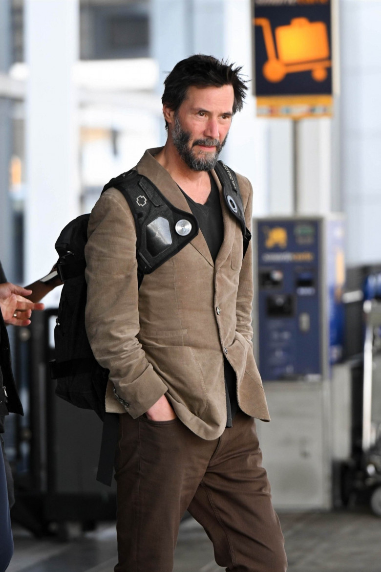 *EXCLUSIVE* A scruffy Keanu Reeves touches down at JFK!