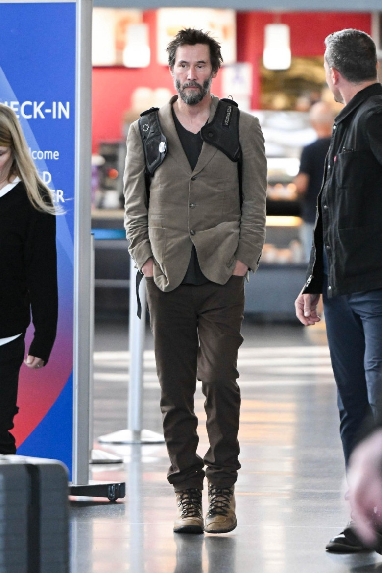 *EXCLUSIVE* A scruffy Keanu Reeves touches down at JFK!