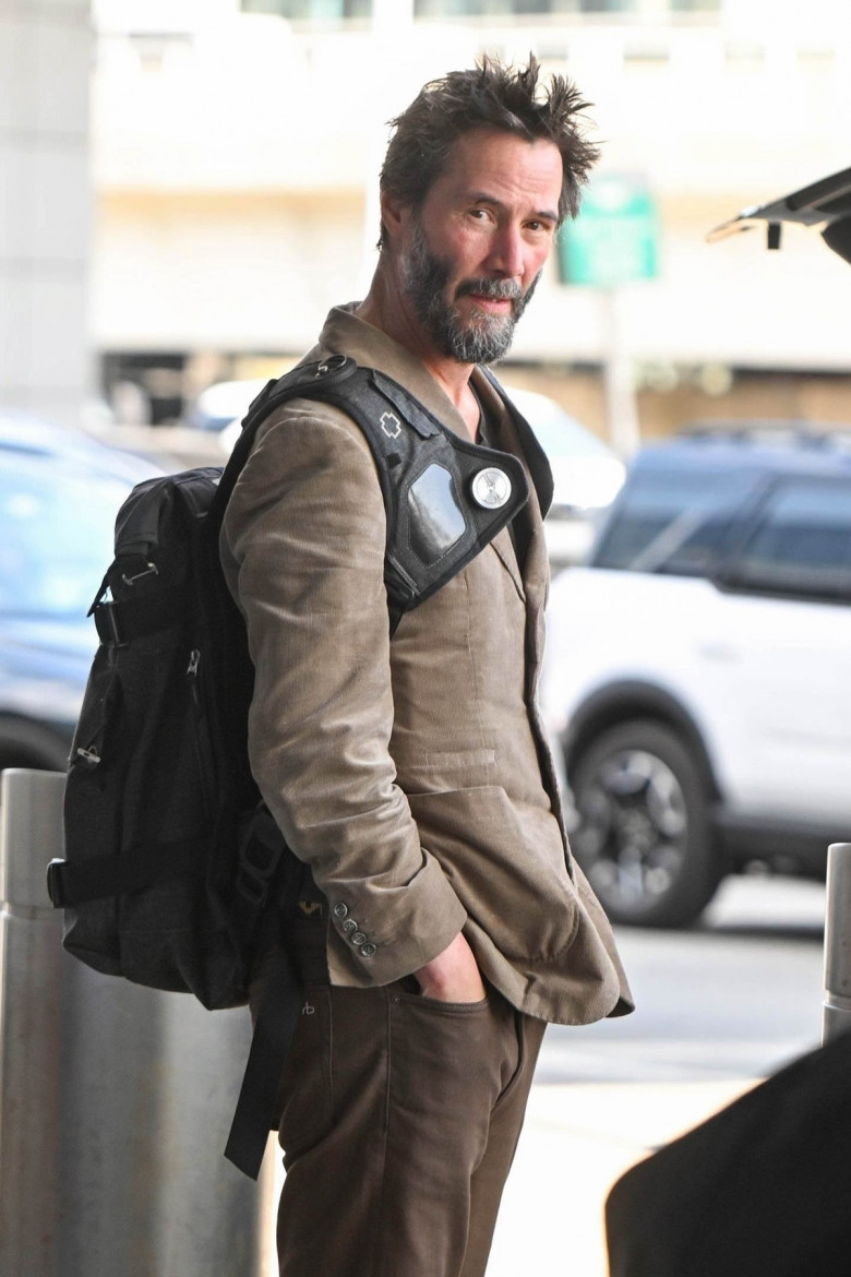 *EXCLUSIVE* A scruffy Keanu Reeves touches down at JFK!