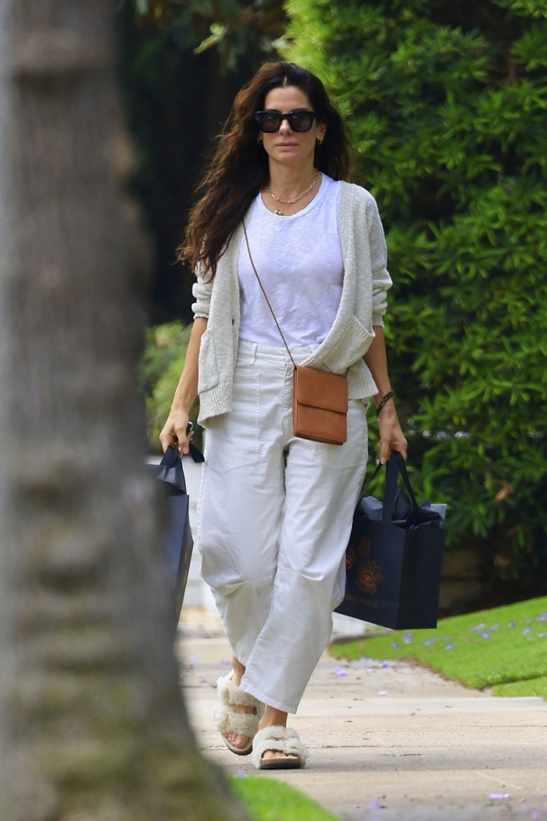 *EXCLUSIVE* Sandra Bullock is all smiles after leaving a dermatologist appointment in Beverly Hills as it was just recently announced she will be reprising her role in the sequel to the movie "Practical Magic"