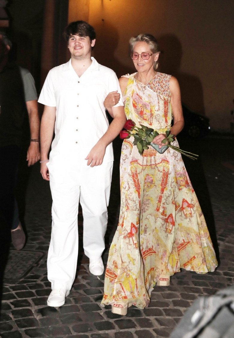 *EXCLUSIVE* The American Actress Sharon Stone looks in great spirits as she enjoys a spot of dinner with Gabriele Israilovici and son Laird at Dal Bolognese restaurant during a visit to the eternal city of Rome.