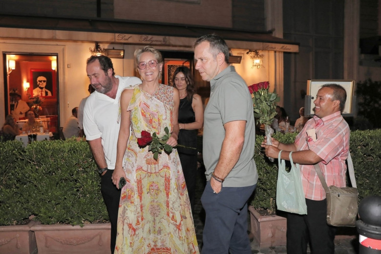 *EXCLUSIVE* The American Actress Sharon Stone looks in great spirits as she enjoys a spot of dinner with Gabriele Israilovici and son Laird at Dal Bolognese restaurant during a visit to the eternal city of Rome.