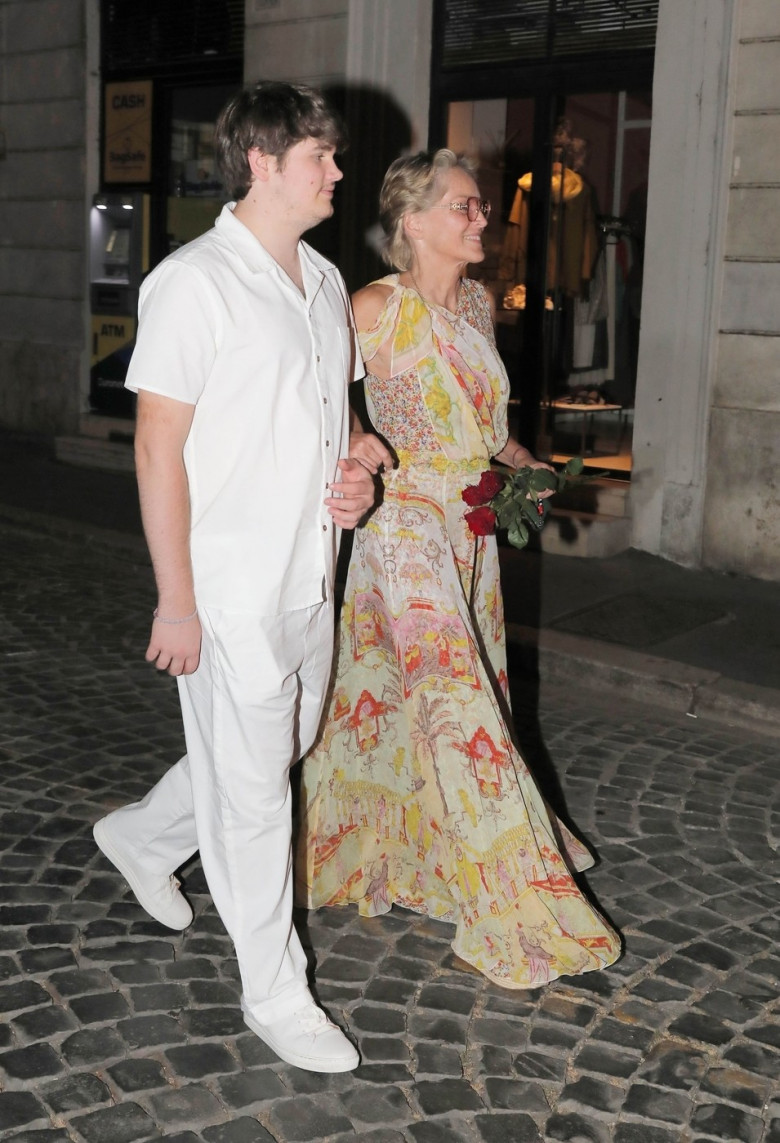 *EXCLUSIVE* The American Actress Sharon Stone looks in great spirits as she enjoys a spot of dinner with Gabriele Israilovici and son Laird at Dal Bolognese restaurant during a visit to the eternal city of Rome.