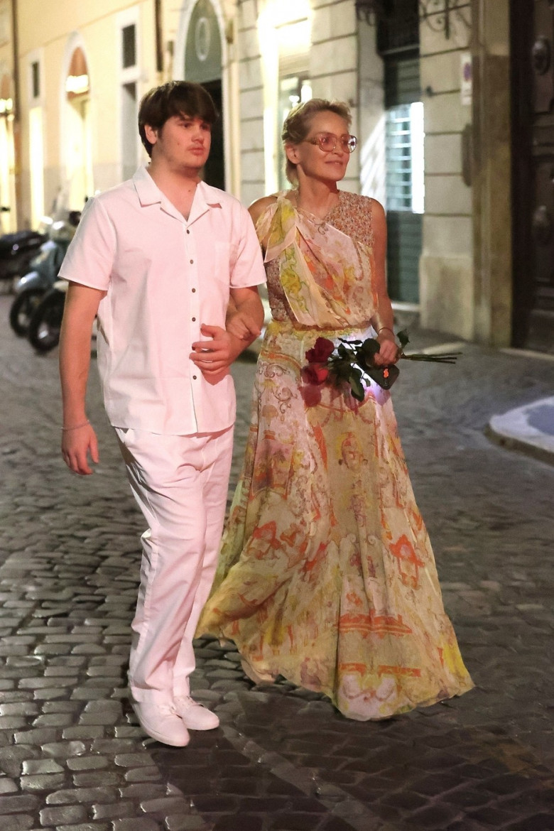 *EXCLUSIVE* The American Actress Sharon Stone looks in great spirits as she enjoys a spot of dinner with Gabriele Israilovici and son Laird at Dal Bolognese restaurant during a visit to the eternal city of Rome.